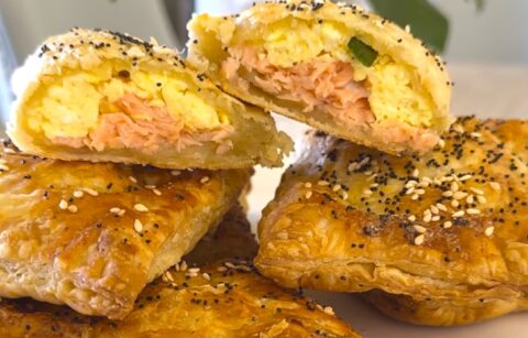 Stacked and open Breakfast egg Salmon Wellington, Salmon en Croute Pastry, is a warm, flaky puff pastry.