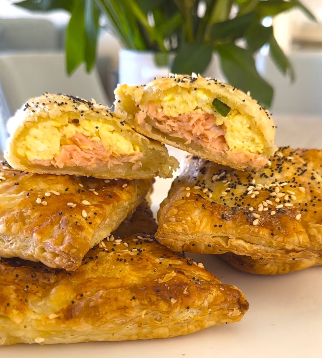 Stacked and open Breakfast egg Salmon Wellington, Salmon en Croute Pastry, is a warm, flaky puff pastry.