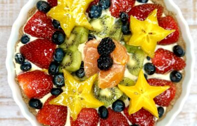 A deliciously healthy tart made of oats and cinnamon, filled with vanilla-lemon custard and topped with in-season fruit and an apricot glaze.