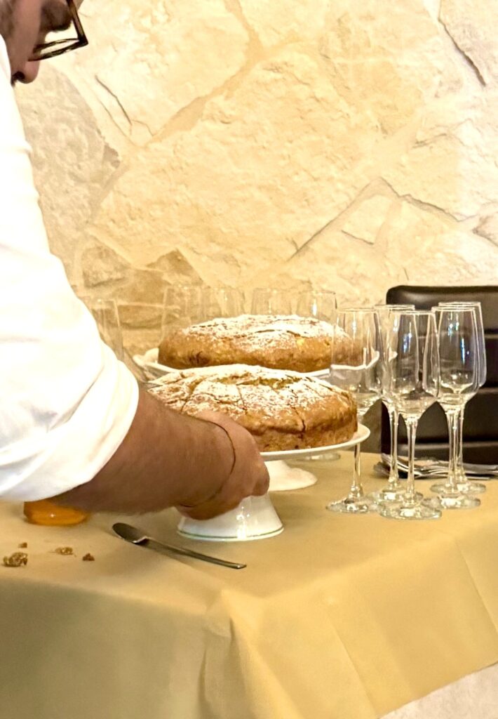 Daniele cuts Olive Sunshine Birthday Cake Harvest Cake