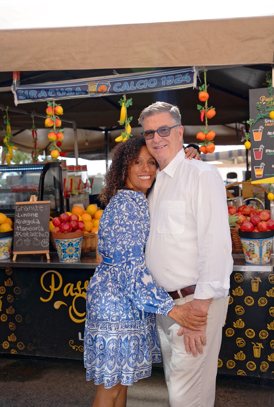 Mark and Sunny - the Olive Sunshine team standing in the Mercato di Ortigia