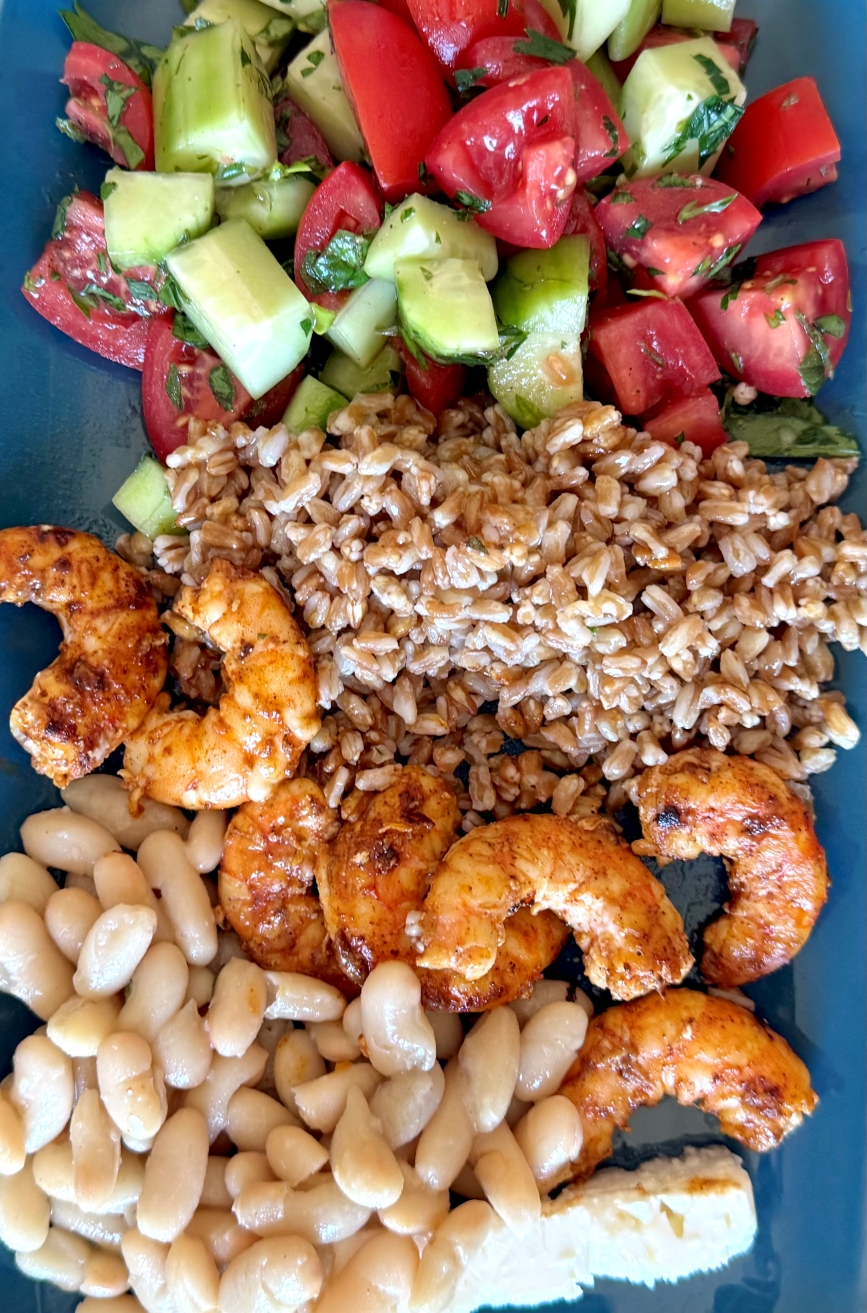 Display of one of the lunches, shrimp, farro, cannellini beans tomato and cucumber salad and a chunk of Feta cheese. Day 1 lunch of 0-day-Sicilian-Summer-meal-plan-